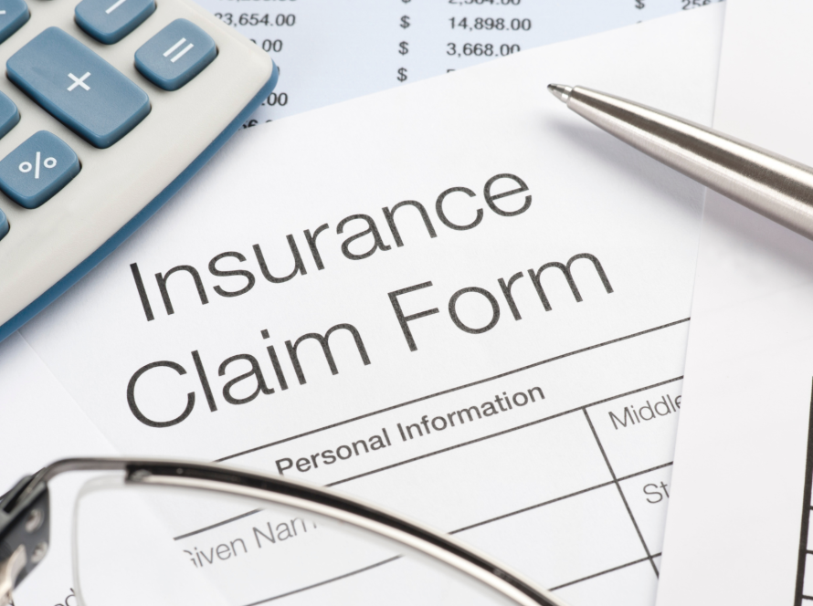 Insurance adjuster inspecting vehicle collision damage